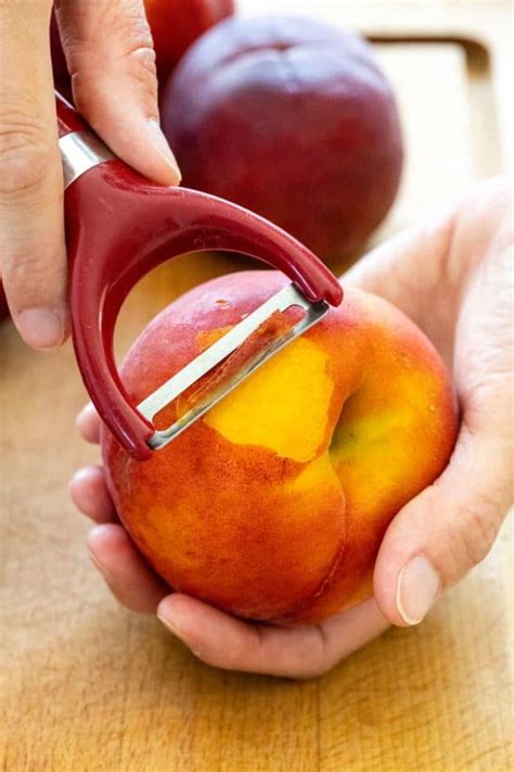 “Peeling peaches is like peeling tomatoes. If they are really ripe, they almost peel themselves. Drop them in boiling water for 30 seconds then into cold water ...